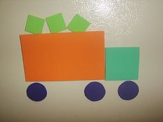 a piece of paper that has been cut out to look like a train with blocks on it