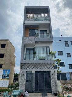 an apartment building with balconies on the second floor