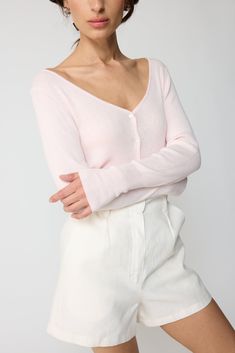 The essential spring button down v neck cardigan. Plunged neck line with ribbed cuffs and hemline. It's a soft lightweight cardigan. Pink V-neck Cardigan For Loungewear, Solid Color V-neck Cardigan For Everyday, Versatile V-neck Cardigan With Button Closure, Spring V-neck Sweater With Button Closure, Summer V-neck Cardigan With Button Closure, Spring V-neck Cardigan For Layering, Trendy Ribbed V-neck Cardigan, Spring V-neck Sweater With Ribbed Cuffs For Layering, Fine Knit Long Sleeve V-neck Sweater For Spring