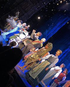 a group of people standing on top of a stage