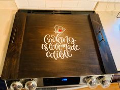 a stove top with the words cooking is love made easy on it's side