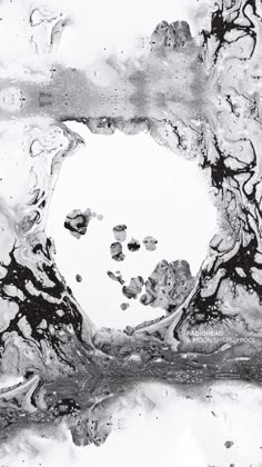 an abstract black and white painting with lots of water droplets on it's surface