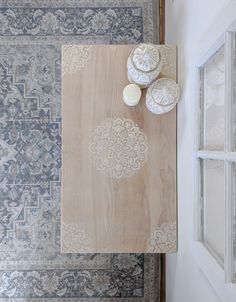 an overhead view of a table with plates and bowls on it next to rugs