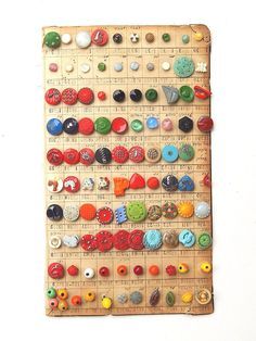 a wooden ruler with many different buttons on it