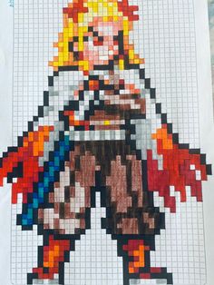 an image of a pixel art piece made out of paper and colored pencils on top of graph paper