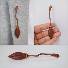 a hand holding an object made out of wood and other things that are attached to it