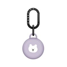 a purple key chain with a white bear on it's face and black handle