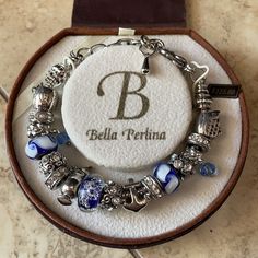 Bella Perlina Nautical Themed Charm Bracelet. Has An Adorable Cruise Ship Charm, Anchor Charm, & Cocktail Charm. Also Had Some Blue & White Charms. Brand New In Original Box. Elegant Blue Nickel Free Charm Bracelet, Anchor Charm, Nautical Jewelry, Nautical Theme, Cruise Ship, Silver Blue, Womens Jewelry Bracelets, Blue And Silver, Nautical