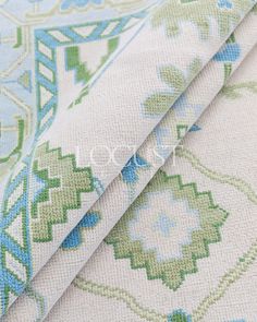 two pieces of fabric with blue and green designs