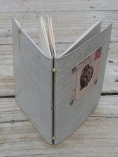 an open book sitting on top of a wooden table