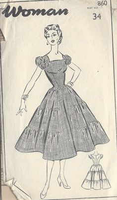 a woman's dress with ruffles and sleeves