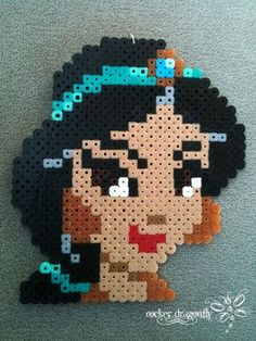 an image of a woman made out of perler beads