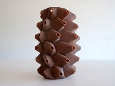 a sculpture made out of clay sitting on top of a table