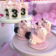 there are three birthday cakes that look like minnie mouses on top of each other