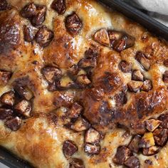 a casserole dish with meat and cheese on it, ready to be eaten