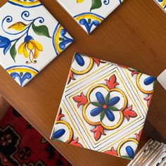 some colorful tiles are sitting on a table