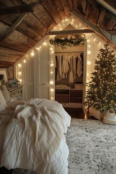 an attic bedroom decorated for christmas with lights on the ceiling and a tree in the corner