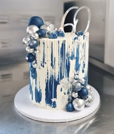 a blue and white cake decorated with ornaments