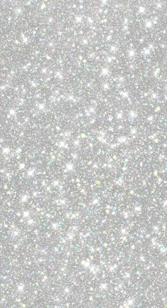 an abstract silver glitter background with small white dots on the top and bottom half of the image