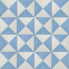 a blue and white tiled wall with triangles on the bottom, in different shades of blue