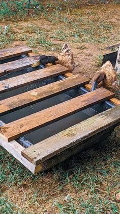 the wooden pallet is being built to hold water