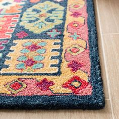 a colorful area rug on the floor