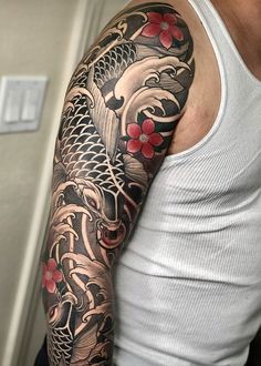 a man with a tattoo on his arm