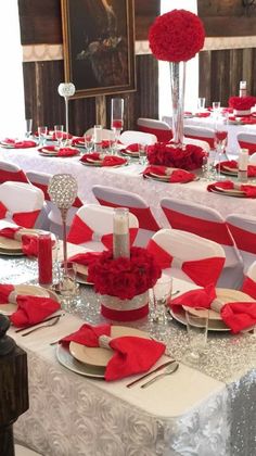 the table is set with red and white linens