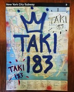 a poster with the words ny taxi 138 written in blue ink on a wood background