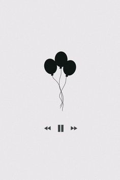 black balloons floating in the air with an arrow pointing to one side and two arrows at the other