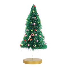 a small green christmas tree with candy canes on it's top and decorations around the base