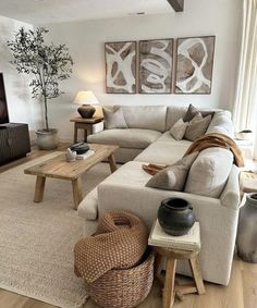 a living room filled with furniture and a flat screen tv on top of a wooden table