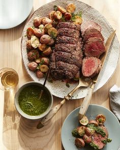 a plate with steak, potatoes and broccoli on it