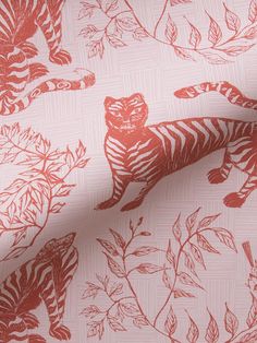 a red and white tiger print fabric with leaves on the side, in front of a pink background