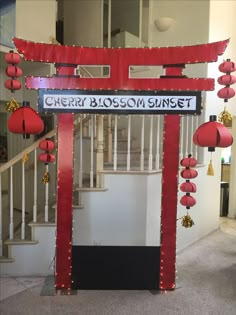 a sign that says cherry blossom street in front of some red lanterns and decorations on the stairs