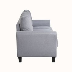 a gray couch sitting on top of a white floor