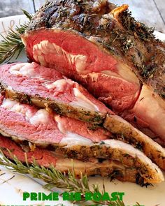 roast beef with herbs and rosemary on a white plate