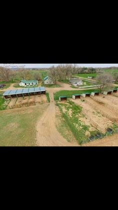 an aerial view of several farm buildings