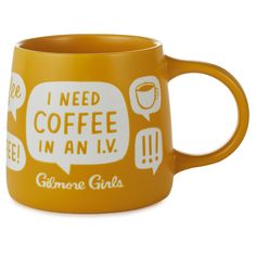 a yellow coffee mug with i need coffee in an iv written on the front and bottom