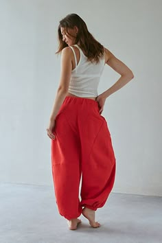 Updated Out From Under sweatpant in a barrel-leg, jogger style. Designed in a so sot fleeced knit featuring a low-rise elasticized waist, drawstring tie and wide barrel legs that cinch at the ankles. Only at Urban Outfitters. Features Out From Under Kai Extreme barrel jogger Barrel leg pant Soft and stretchy fleeced knit Low rise elasticized waist with tie Wide barrel leg Cinched hems Oversized, relaxed fit Cropped length Easy pull-on style UO exclusive Content + Care 58% Cotton, 42% polyester M Barrel Leg Pants, Barrel Pants, High Waisted Joggers, Cropped Sweatpants, Red Fits, Athletic Style, Fashion Joggers, Red Outfit, Athletic Fashion