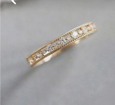 an image of a wedding ring with diamonds on it