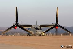 an airplane is sitting on the tarmac with its wings extended