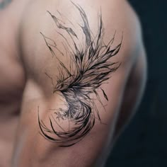 a man's arm with an artistic tattoo on it