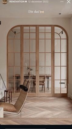 a living room filled with furniture next to an open door that leads into a dining area