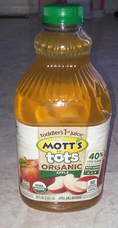 a bottle of mott's top organic apple juice