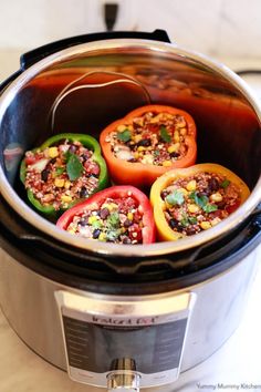 several bell peppers are in the slow cooker