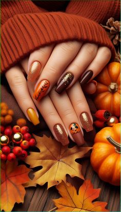 Embrace the cozy colors of fall with this gorgeous autumn-themed nail design! 🍂🍁 These nails feature rich shades of burnt orange, deep brown, and shimmering gold glitter, creating a warm and inviting look perfect for the season. Each nail showcases unique details, including a glittery gradient, a delicate leaf design, and a playful pumpkin accent for a hint of Halloween spirit. Ideal for anyone looking to add a touch of autumn to their style! Perfect for Thanksgiving, fall gatherings, or just showing off those seasonal vibes. Short Thanksgiving Nails, Shades Of Burnt Orange, Nail Art For Fall, Ombre Velvet, Autumn Nail Art, Cozy Colors, Thanksgiving Nail