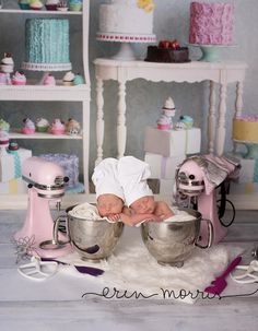 a baby is sitting in a bowl surrounded by mixers