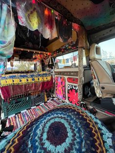 the interior of a vehicle decorated with colorful rugs