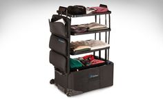 three tiered luggage cart with clothes in it